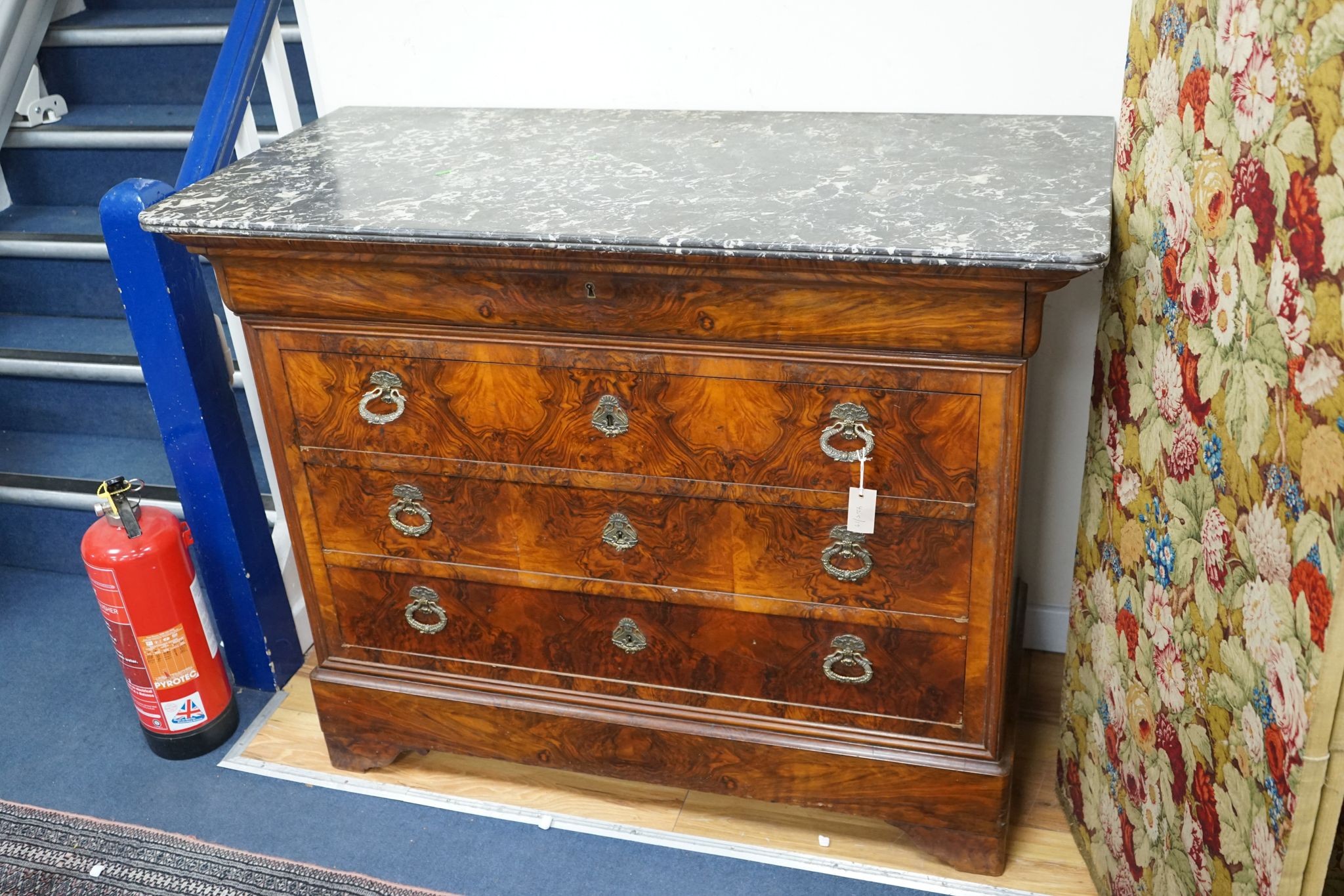 A 19th century French marble top walnut commode, width 129cm, depth 60cm, height 104cm